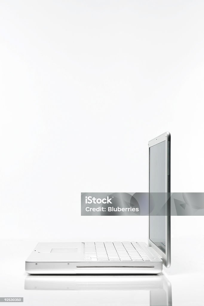 Laptop on White Side angle view of laptop on white background. Backgrounds Stock Photo