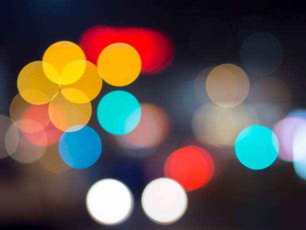 istock camera lens bokeh effect with traffic lights 925303736
