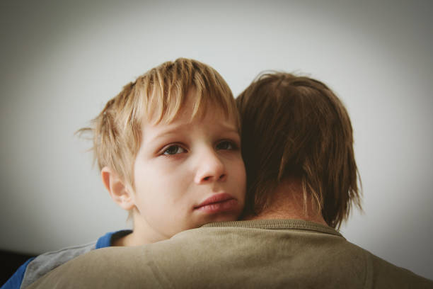istock father comforting stressed sad son 925303786