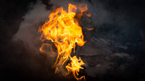 istock Flame of fire burning and smog on dark background 925306956