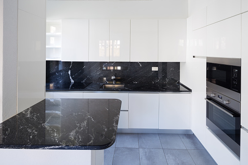 Details of white and black modern kitchen