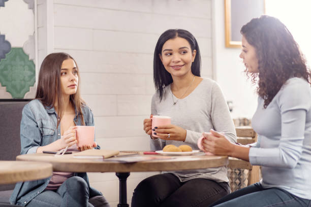 istock Appealing three friends sharing news 925309034