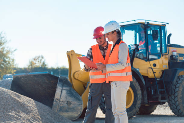 istock Man and woman worker on construction site 925309892