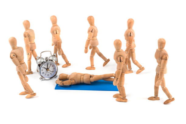 istock Wooden mannequin relaxing on bottom in the crowd 925310408