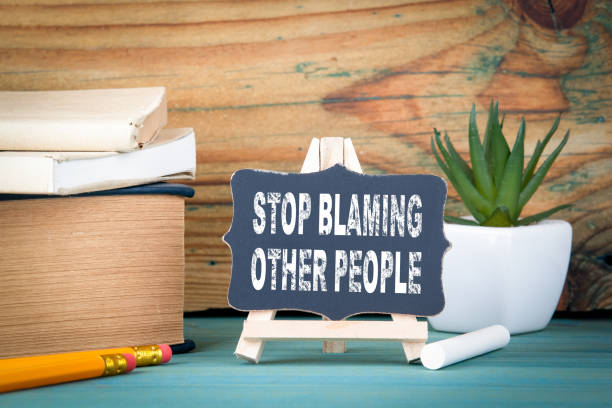 Stop blaming other people. small wooden board with chalk on the table