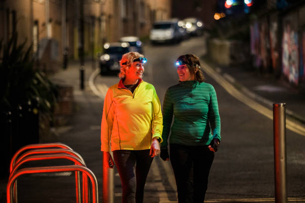 Two Friends Walking Together At Night