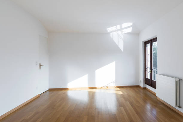 Completely empty room with wooden floors