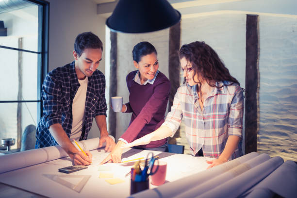 istock Group of young architects working together in architecture studio 925319148
