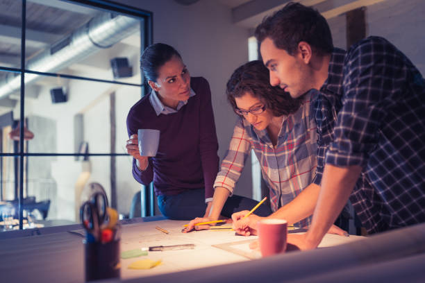 istock Group of young architects working together in architecture studio 925319180