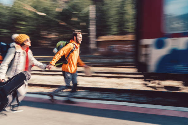 Young couple running to catch the train