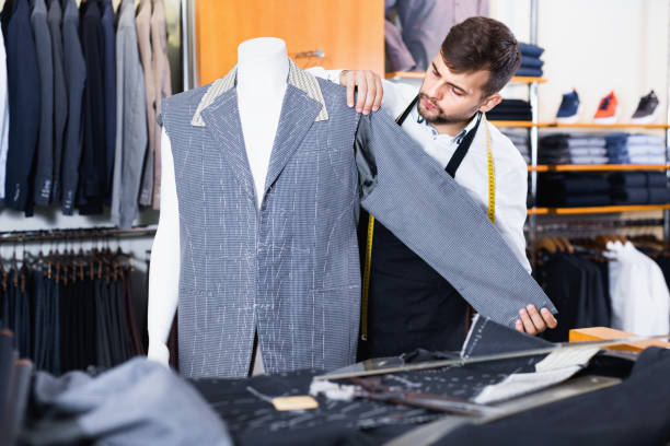 istock Handsome male tailor  working  in atelier 925328112