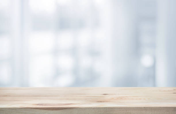 istock Wood table top on white abstract background form office building. 925329716