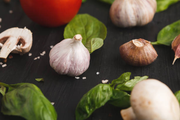 istock Fresh mushrooms and garlic closeup on rustic wood 925331090
