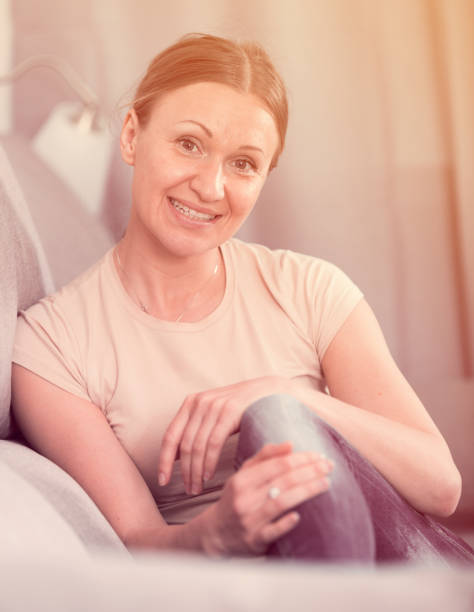 istock Positive woman relaxing on sofa 925331506