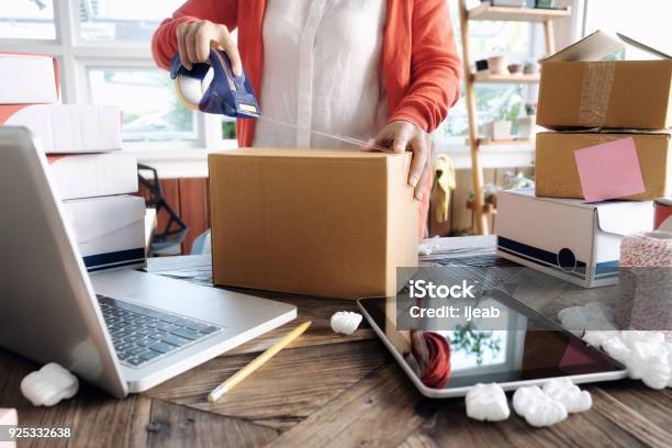 Young Startup Entrepreneur Small Business Owner Working At Home Packaging And Delivery Situation Stock Photo - Download Image Now