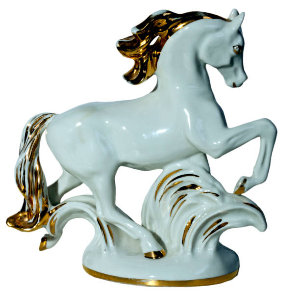 istock Porcelain horse on white background 925335550