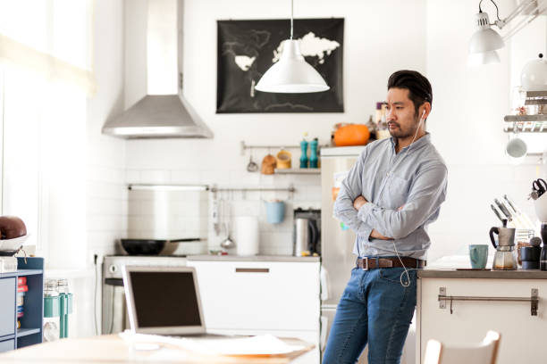 istock Listening to podcast from home office 925336362