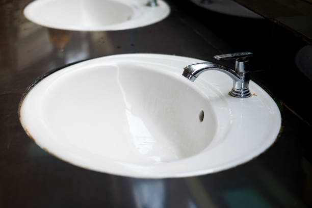 istock Water tap in modern public bathroom 925340958
