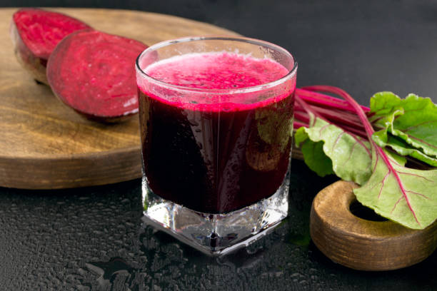 istock Beet fresh juice on a dark background. 925341222