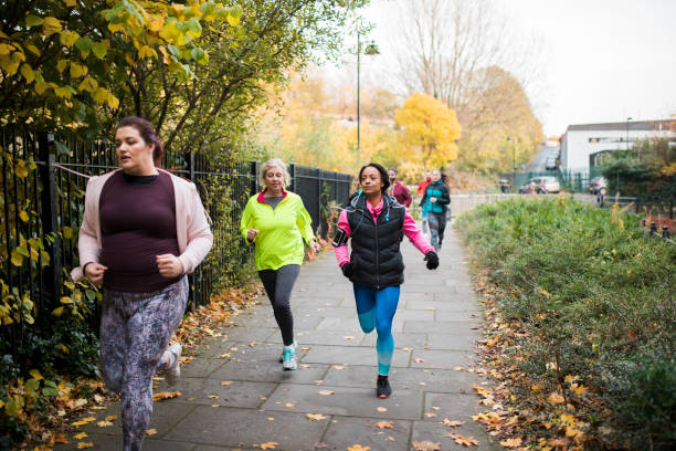 istock Group Of Friends Running Together 925341444