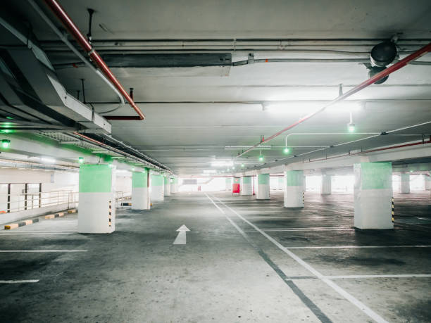 istock construction for automatic technology check for empty area of car parking lane in shopping mall with red fire extinguisher no the wall 925344600