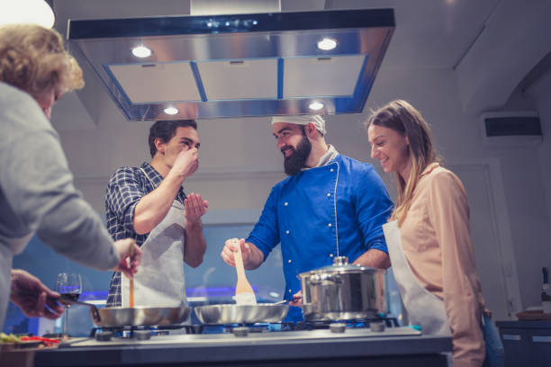 istock Chef is supervising attendees of cooking class 925345390