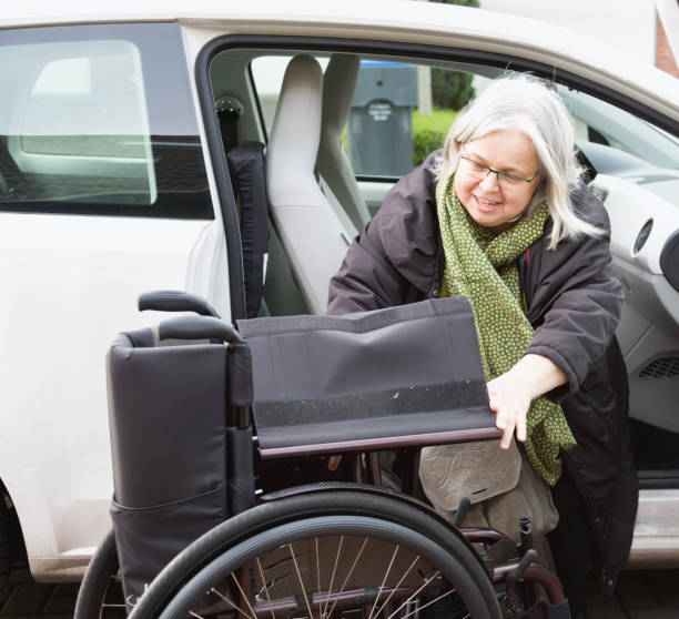 istock Disabled woman getting into a car 925349464