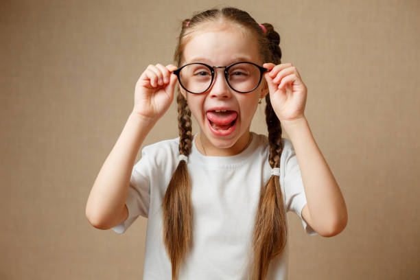 istock little girl with big glasses 925358378
