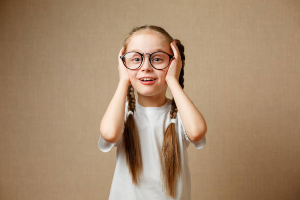 istock Cute schoolgirl in glasses 925358398