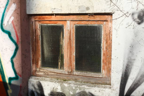 istock old basement window made of wood 925358558
