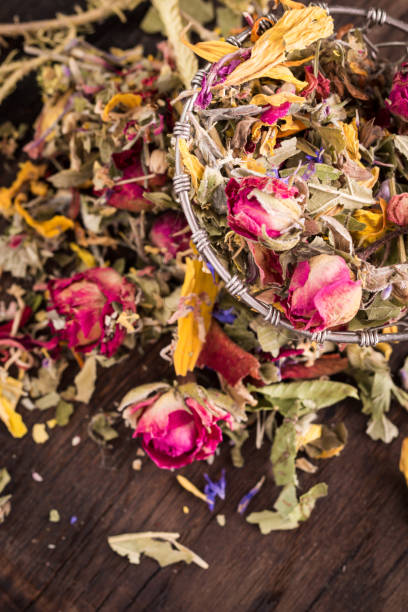 istock herbal tea with dry roses on wooden vintage table 925366494