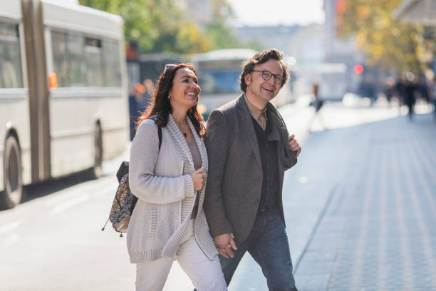 istock Couple crossing the street 925369424