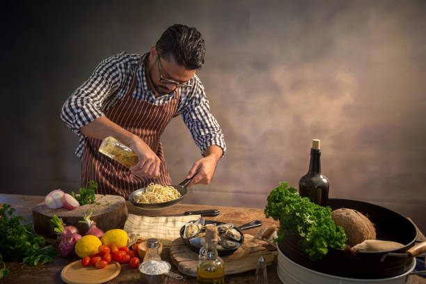 istock Man cook chef hipster with handsome bearded face in a hat 925370468