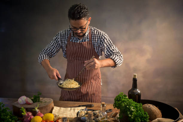 istock Man cook chef hipster with handsome bearded face in a hat 925370578