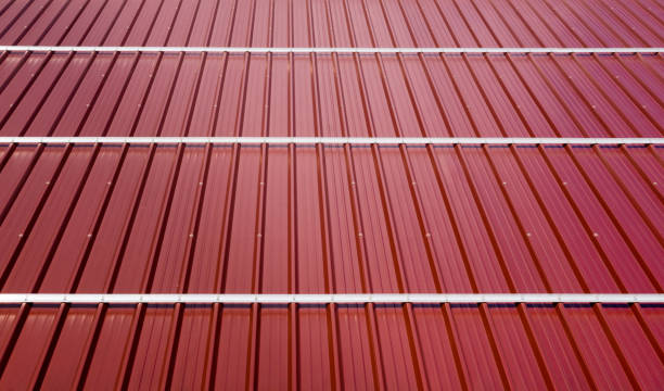 istock Corrugated roof metal sheets. Modern types of roofing materials. 925371004