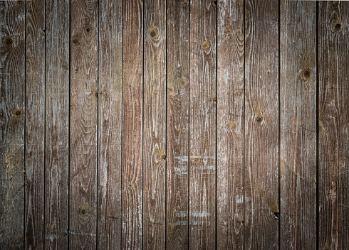 Rustic wood planks background with nice studio lighting and elegant vignetting to draw the attention.