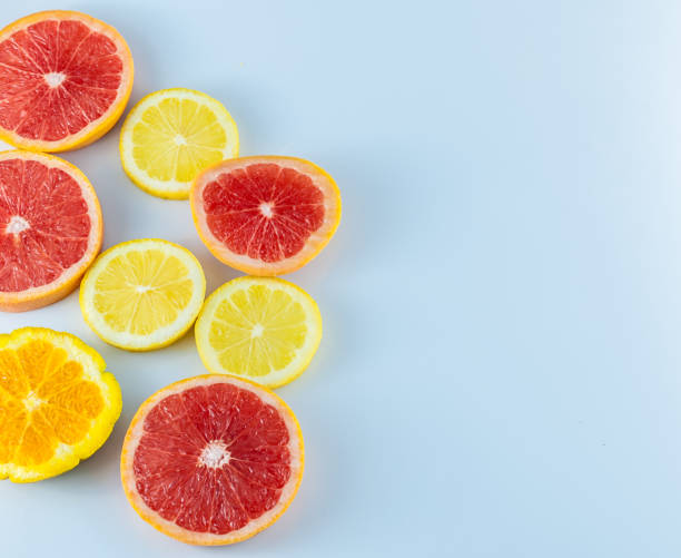 istock Sliced citrus fruits on white background with copy space 925382136