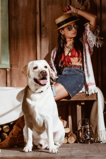 istock woman in boho style with dog 925382166