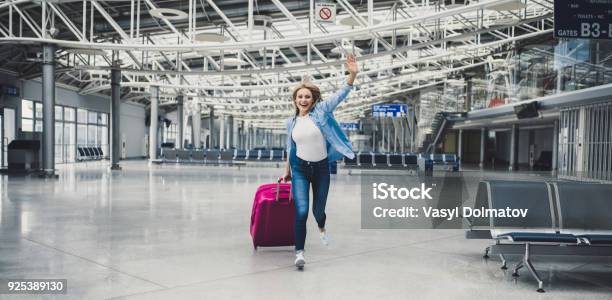 Young Woman In Airport Stock Photo - Download Image Now - Airport, Happiness, Running