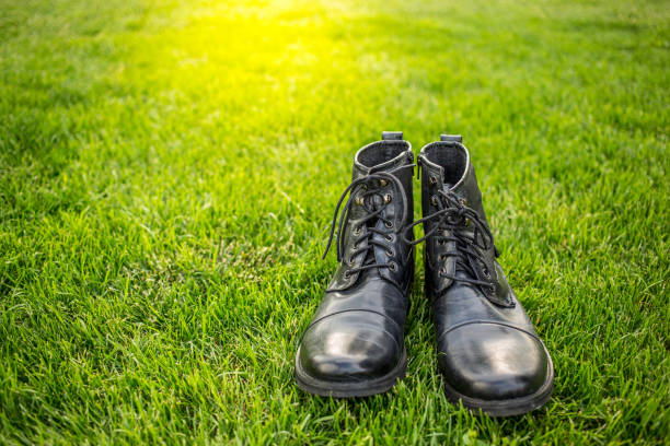 Stylish man shoes on green grass