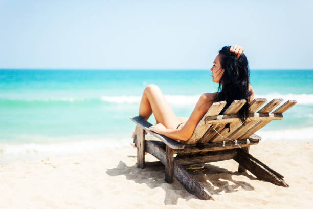 Woman Relaxing On The Beach