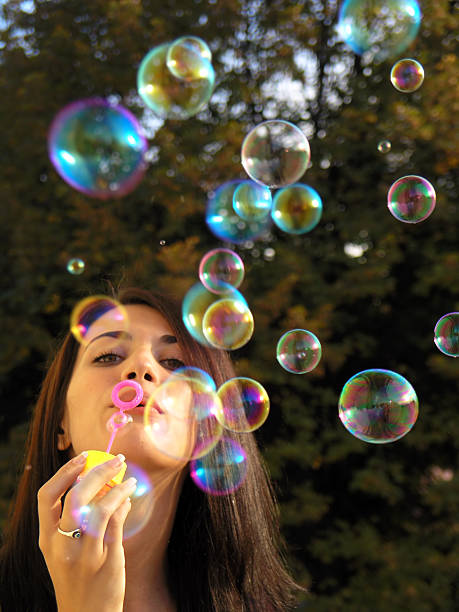 istock Girl blowing soap bubbles 92539266