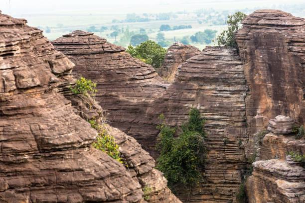 the Domes de Fabedougou  are natural phenomenon of rock sculpted by wind and erosion in Burkina faso look like a stack of pancakes