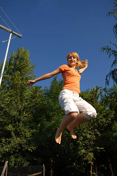 istock Girl Jumping on Trampoline 92539651