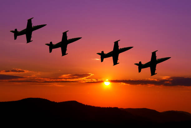 istock Fighter jets in the sky at sunset 925396556