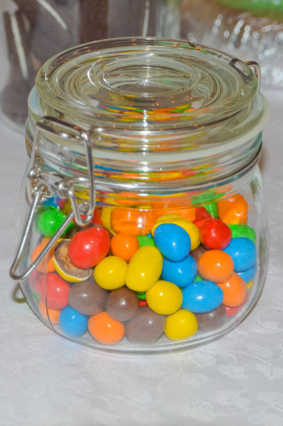 istock multicolored candies in a glass jar 925396578