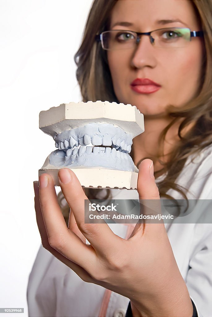 Modello ammaccature mani di dentisti - Foto stock royalty-free di Accudire