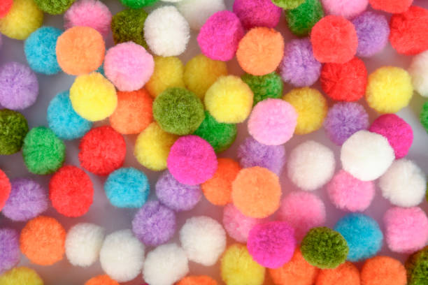 istock A colorful pom pom background 925408818