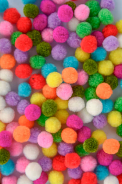 istock A colorful pom pom background 925411486