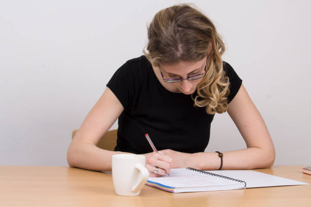 istock Girl writting in her diary 925413818